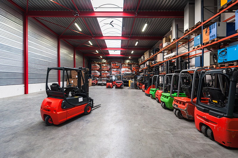 forklifts parked in warehouse