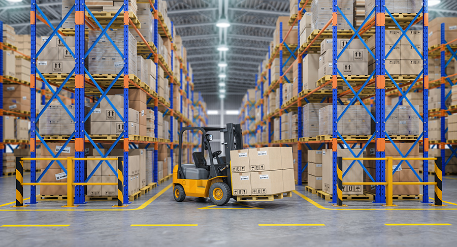 forklift maneuvering between pallet racks in the warehouse