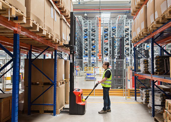 Storehouse Employee Picking Order with a Pallet Jack